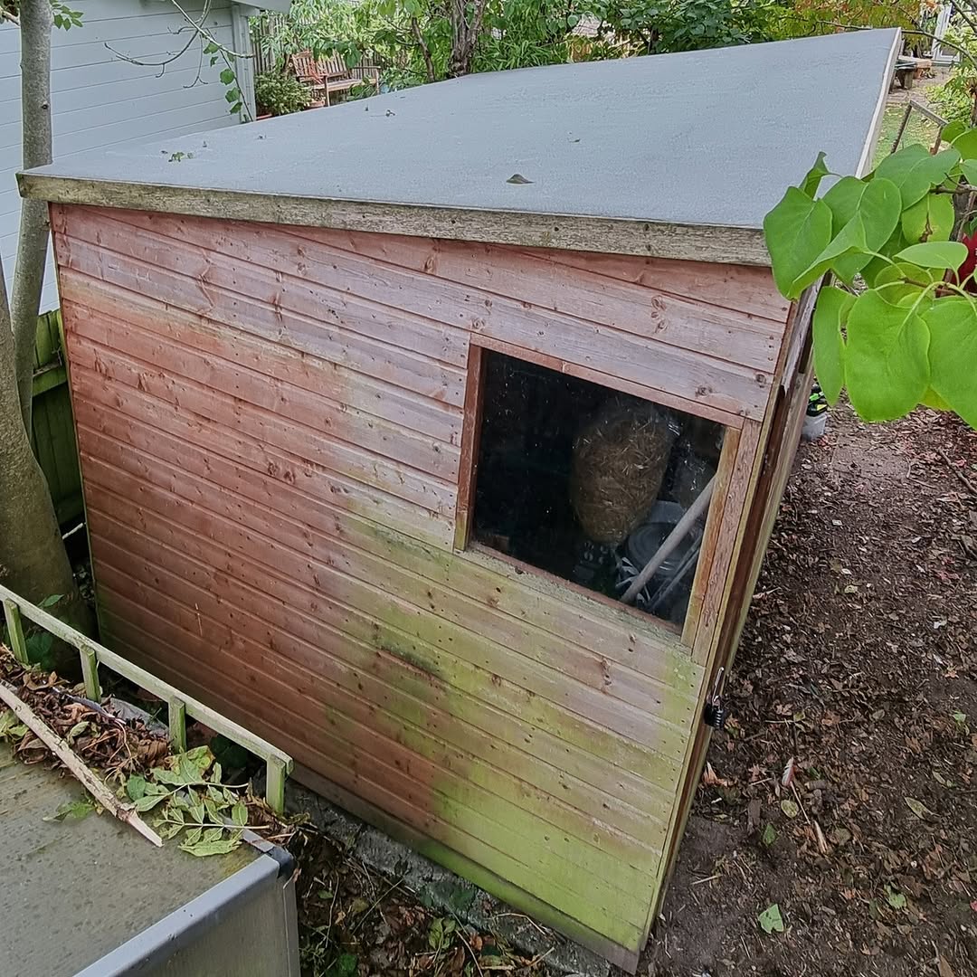 Shed roof after repair with new roofing felt fitted and barge board re-installed